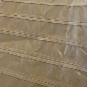 Hanging organizer, never used. Plastic inserts, canvas base.